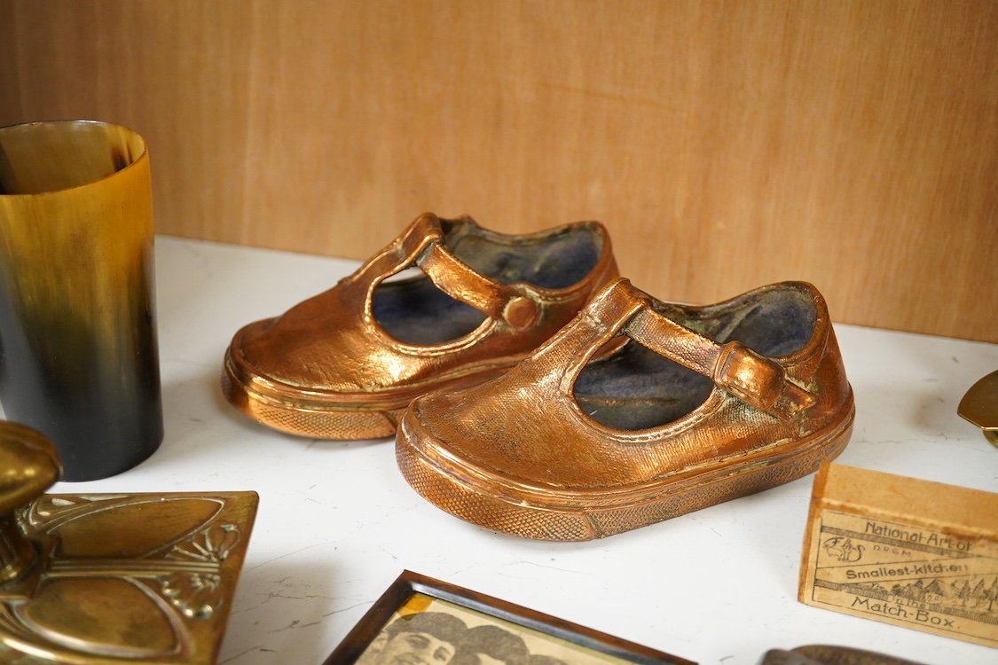 A collection of mixed metalware to include a copper plaque and brass ink blotter, together with a horn beaker